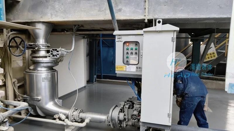 Sistema di trasporto pneumatico con polvere di PTFE